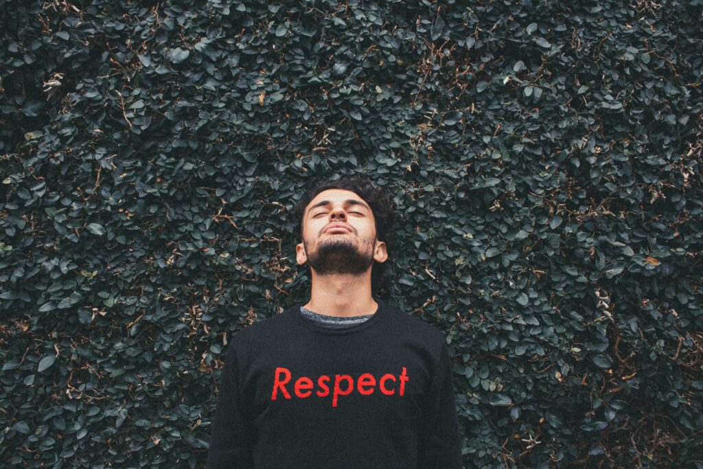 man with "respect" on his sweater